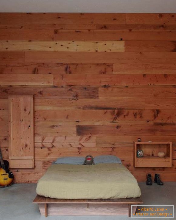 A bedroom in a minimalist style, decorated with a tree