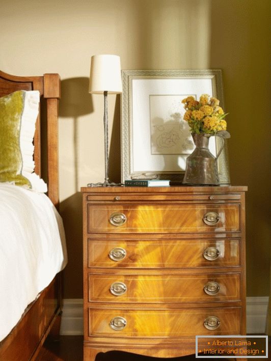 Small chest of drawers near the bed