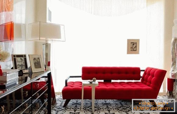 Small chic living room with a red sofa