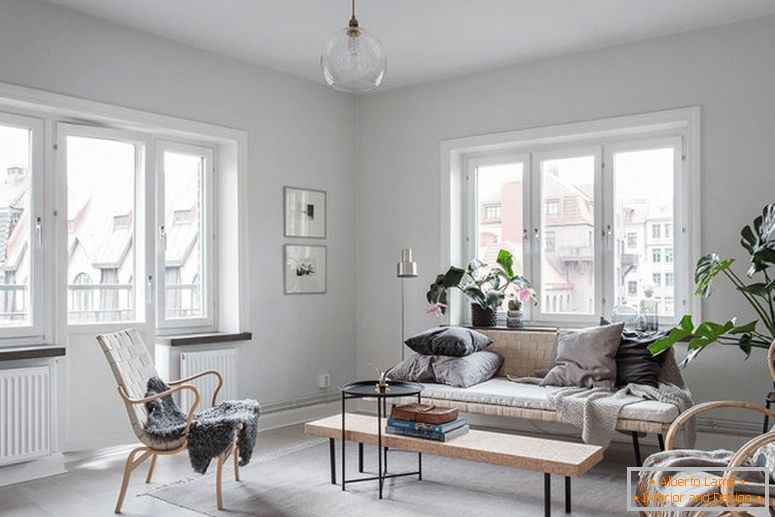 Interior of the apartment in white with large windows