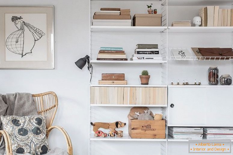 Open shelves in the interior of a white apartment