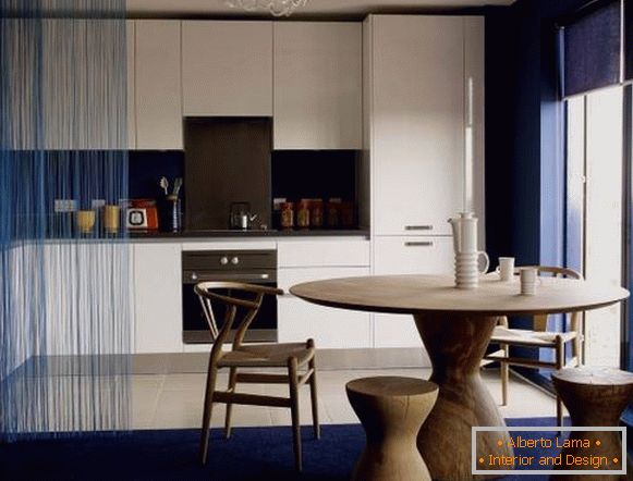 A blue curtain of muslin in the interior of the kitchen