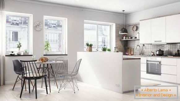 Kitchen and dining area in the Scandinavian studio apartment
