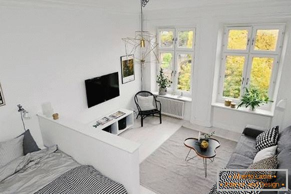 One-room apartment in Scandinavian style - living room and bedroom