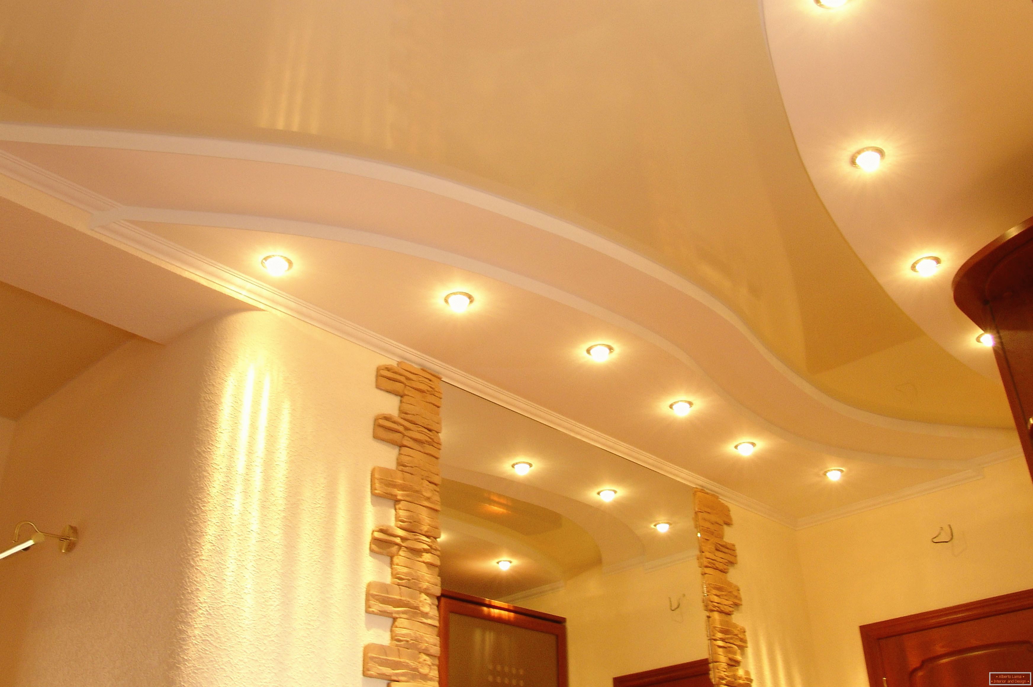 Correctly decorated ceiling in the hallway. Point lighting - the most acceptable option for stretch ceilings PVC.