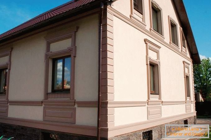 Facade of houses with decorative plaster finishing