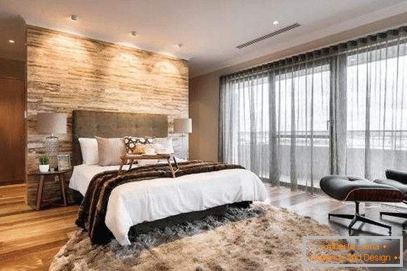 Fashionable gray curtains in the interior of the bedroom - photo