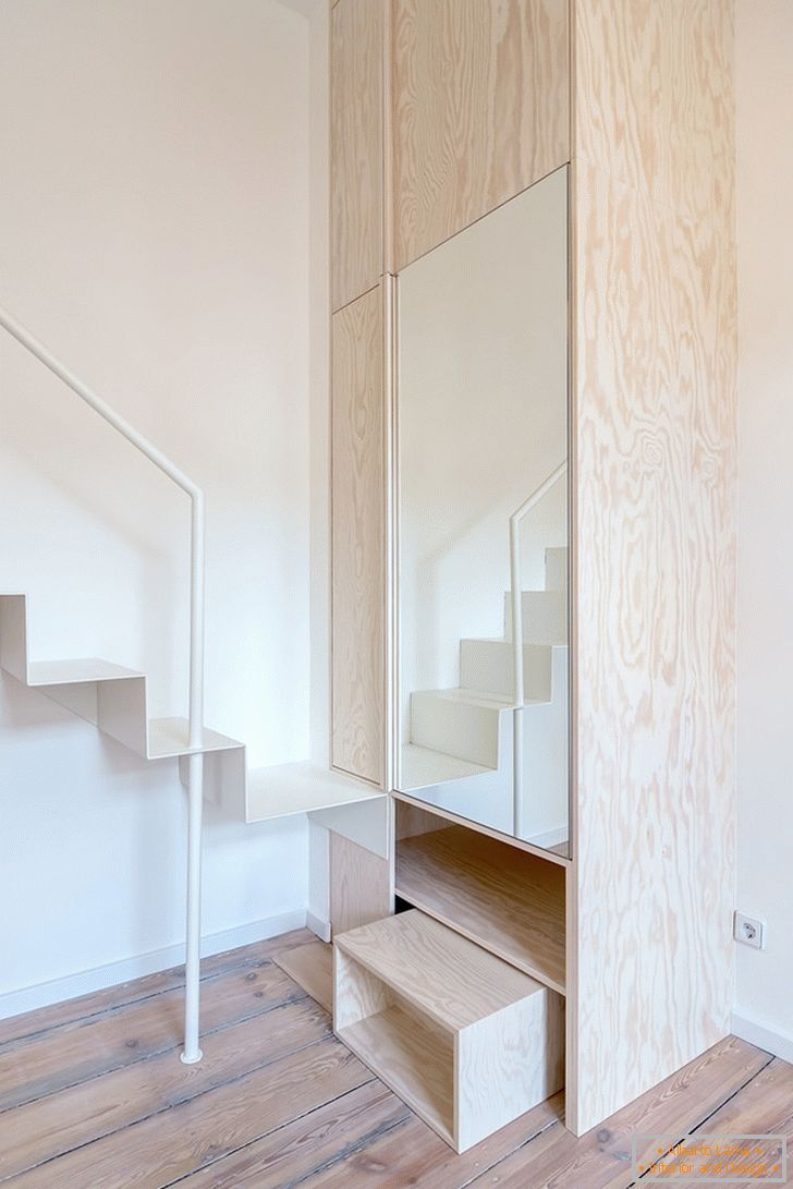 A staircase near the cupboard