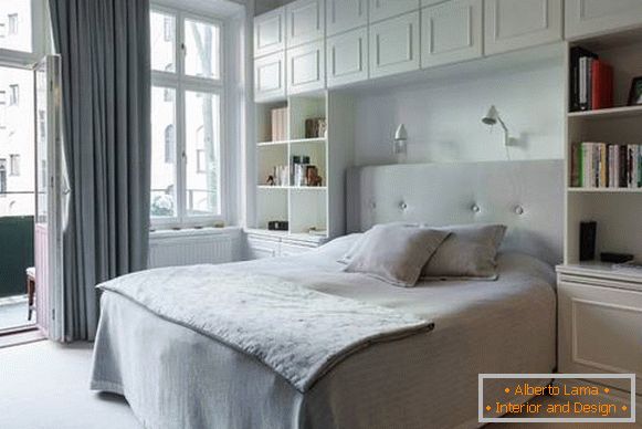 white bedroom in modern style with built-in furniture