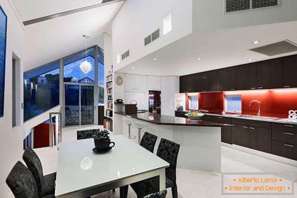 Modern kitchen interior with a window in a private house - photo