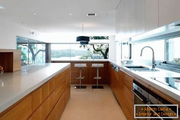 White with brown modern kitchen interior with window in private house