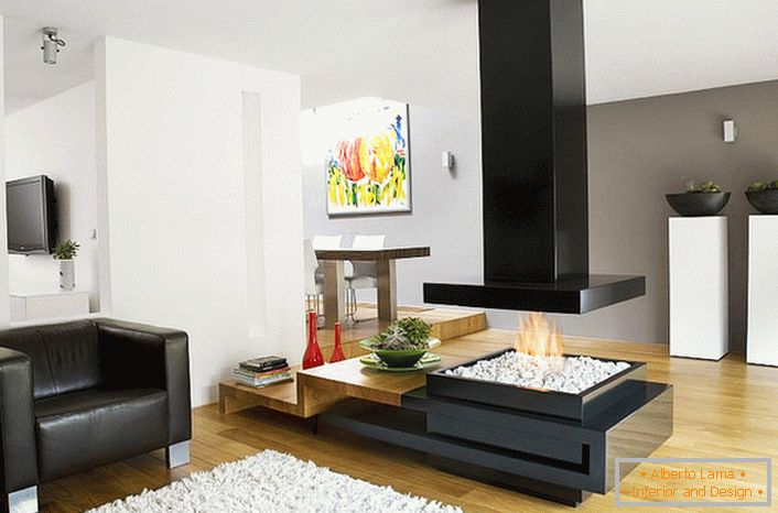 A stylish modern high-tech fireplace divides the sitting area and dining room into a spacious living room.