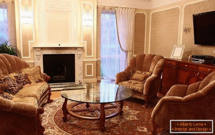 Living room in a classic style. The sofa and armchairs are located in the fireplace area.
