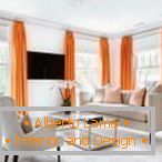 Orange curtains in the bright living room