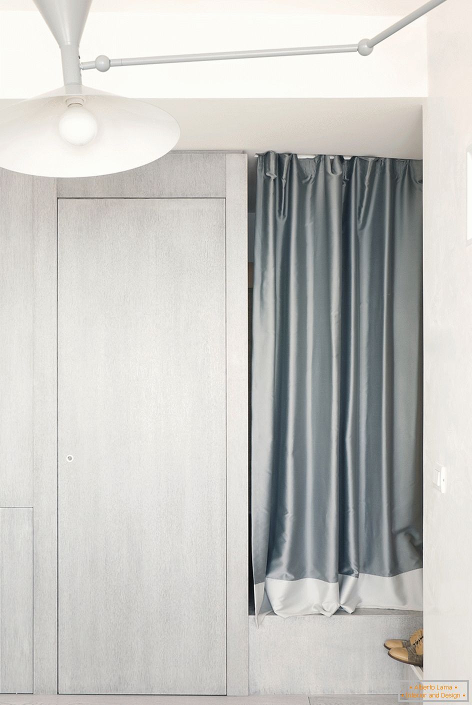 Children behind the curtain in a small studio apartment