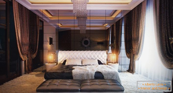Mirror wall in the bedroom in the best traditions of art deco style. Bedroom for a young married couple.