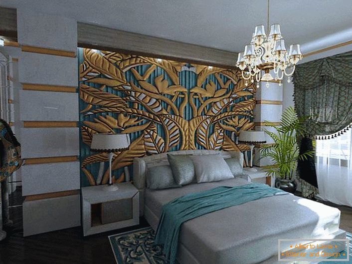 A chic, exclusive emerald-gold panel at the head of the bed is combined with the elements of the room's decor. Bedroom in the style of art deco-royal apartments in a normal apartment.