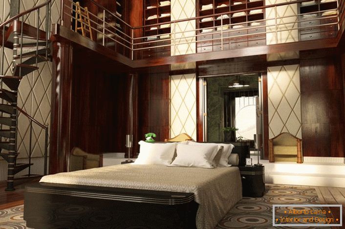 The bedroom with high ceilings is decorated quite effectively. The space is organized functionally and simply. A spiral staircase leads to an impressive wardrobe.