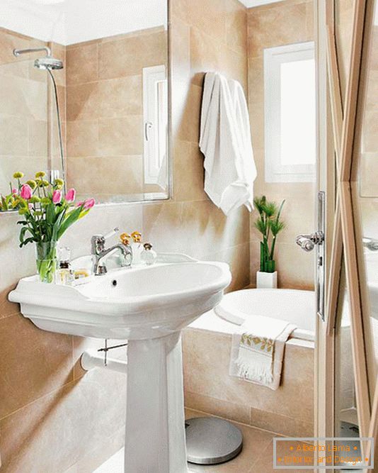 Bathroom in beige tones and marvelous vases with tulips