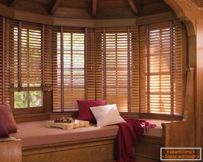 Wooden blinds on the windows create an atmosphere of rural warmth and coziness.