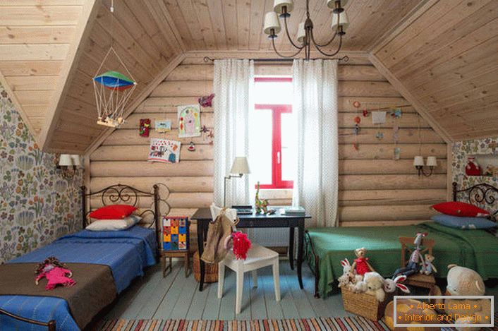 Children's bedroom in country style on the attic floor. A wooden ceiling and a wall with a large window perfectly complement the country style.