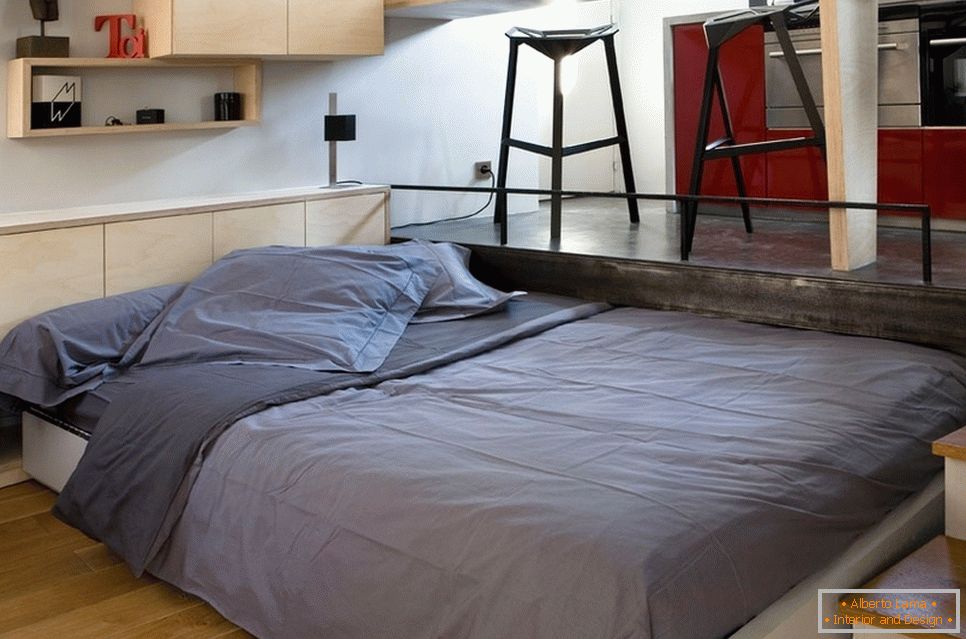 A double bed in a small room