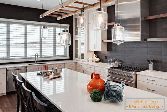 The idea of ​​lighting a kitchen island in the loft style