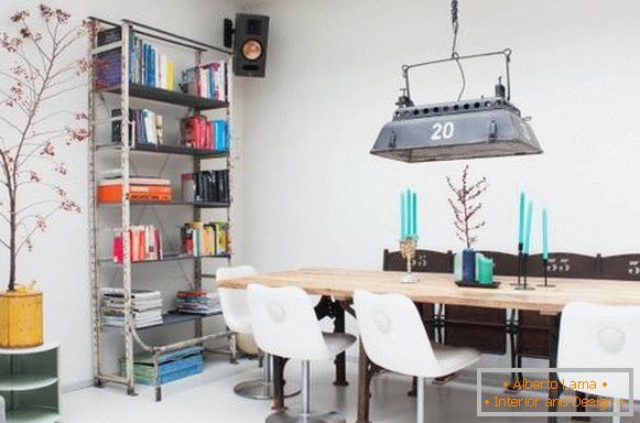 An ancient industrial lamp in the loft interior