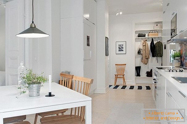 Kitchen interior in Scandinavian style with balcony