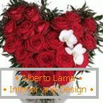 Original bouquet of red roses with a pair of white flowers