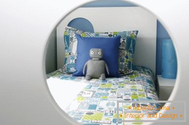 A bed in a small nursery for a boy