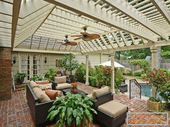 Summer terrace of red brick - photo of house with pool