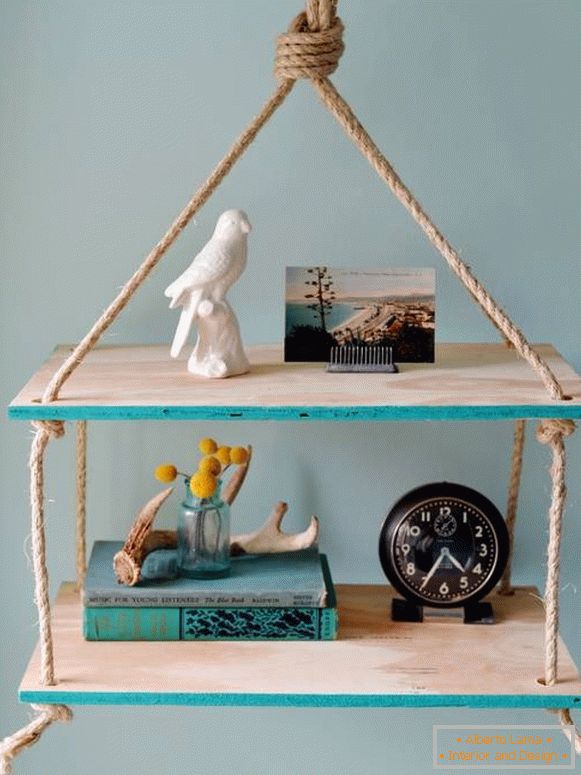 Suspended shelf of boards and ropes