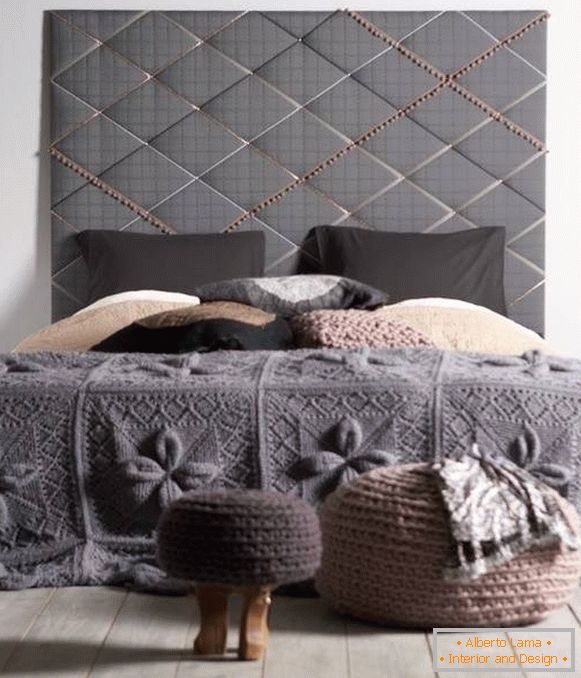 Knitted coverlet on the bed with your own hands