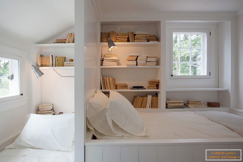 Open book shelves at the bed