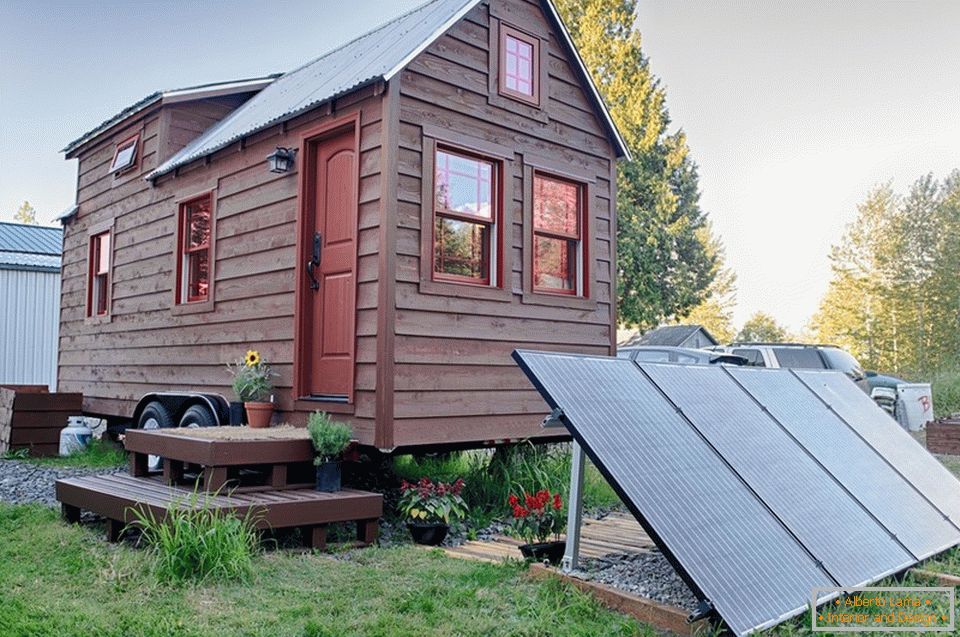 The appearance of a small wooden cottage on wheels