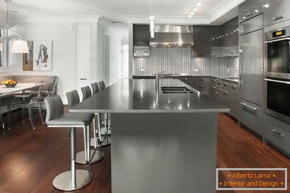 Gray corner kitchen with wooden floor