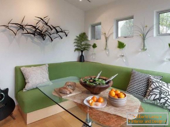 comfortable green corner sofa in the kitchen
