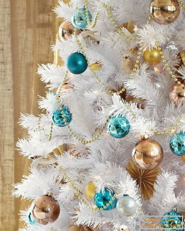 Christmas tree with golden and blue toys