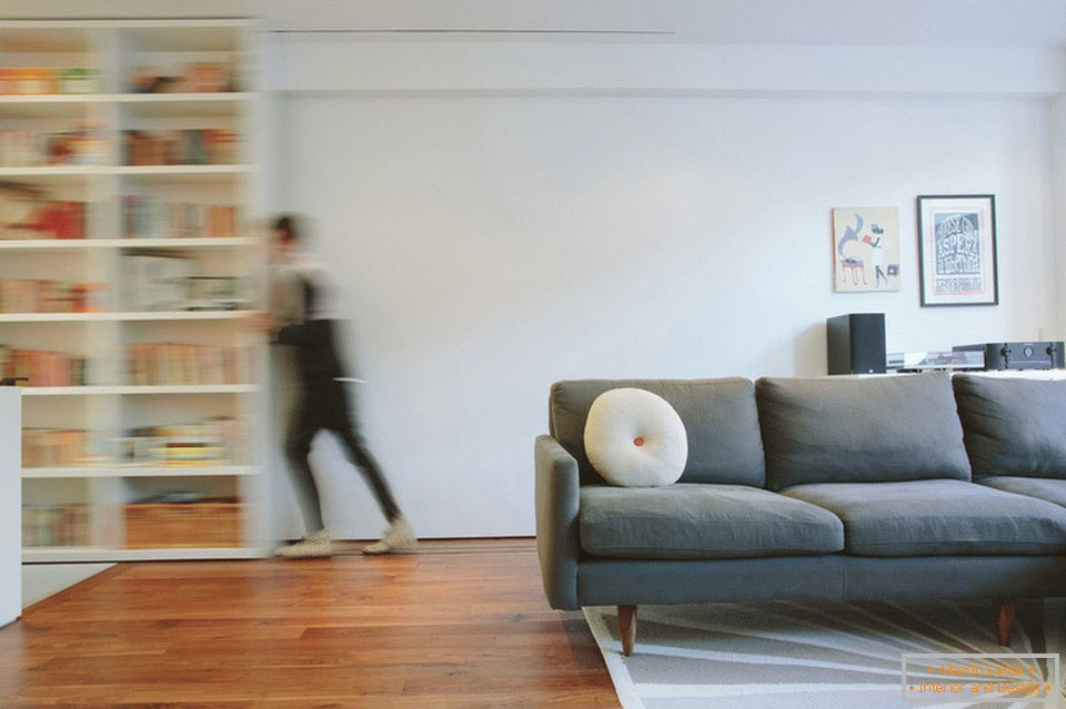 Sliding bookcase in the living room