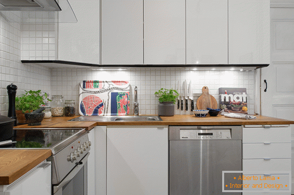 Corner kitchen of a small apartment in Scandinavian style