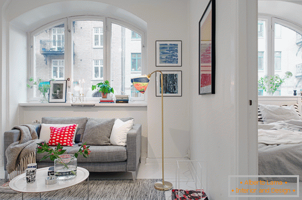 Living room and bedroom of a small apartment in Scandinavian style