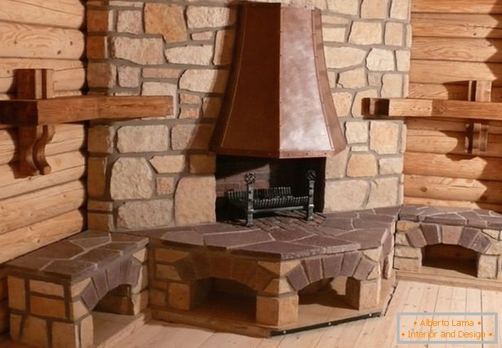 A real corner fireplace with a chimney in a Scandinavian style. Facing the portal with natural stone will allow long to keep the heat in the log cabin country house.