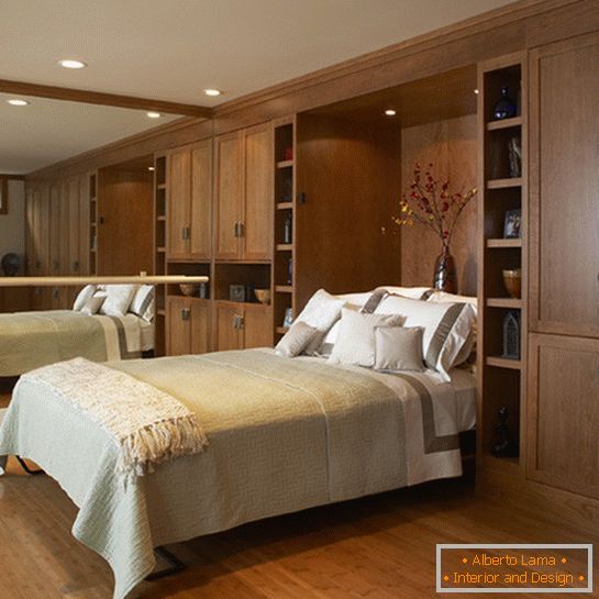 Murphy bed in the bedroom with a mirror