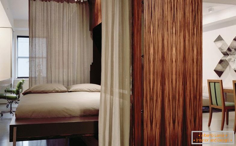 Murphy bed in the bedroom behind the curtains