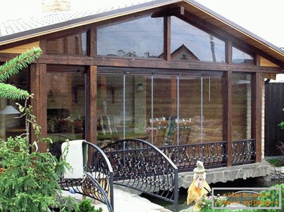 Wooden veranda attached to the house фото 1