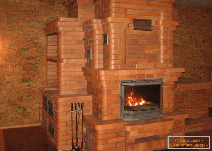 A fireplace with cast cast-iron furnace and a massive portal made of bricks will warm the house for a long time.