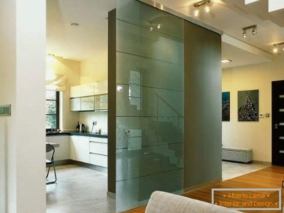 Glass door to the kitchen in a modern interior