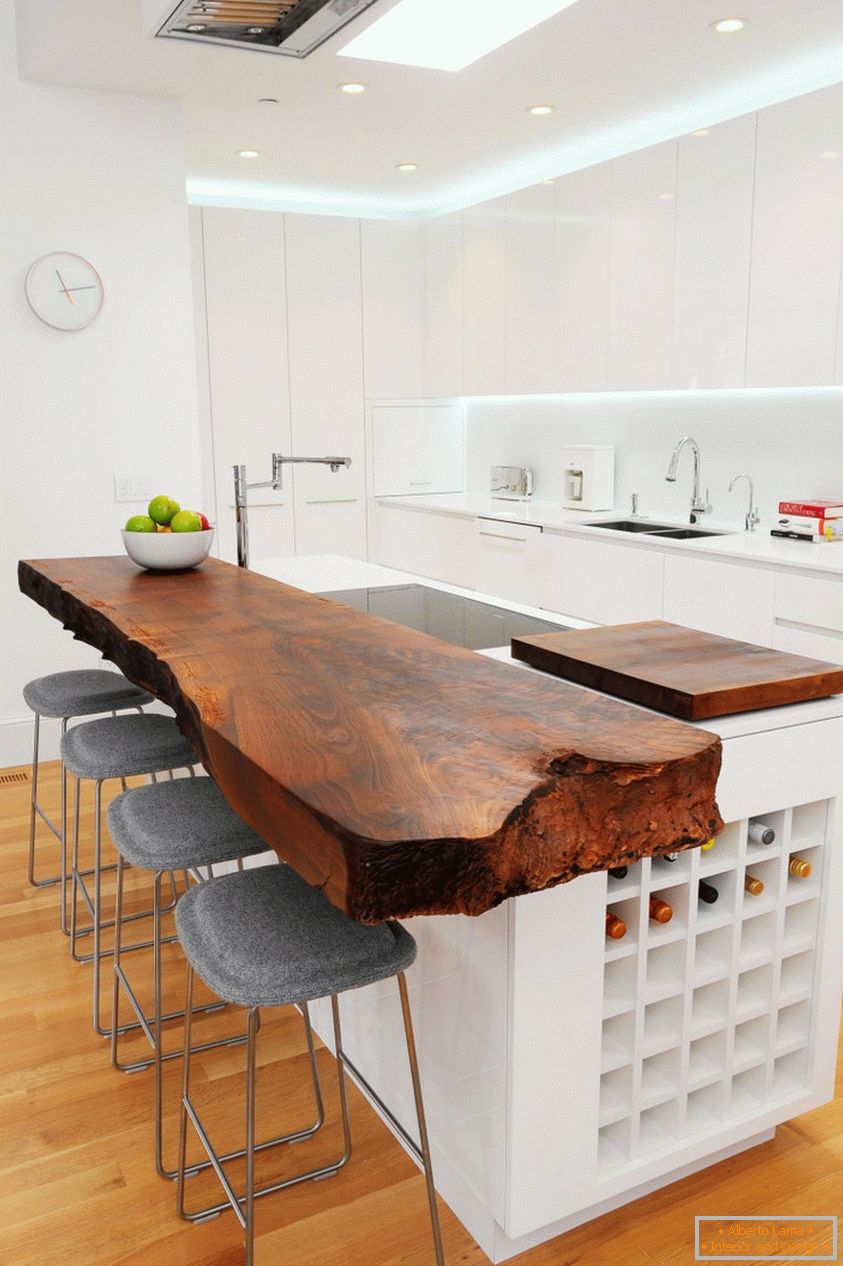 Modern kitchen in white with a solid wood top