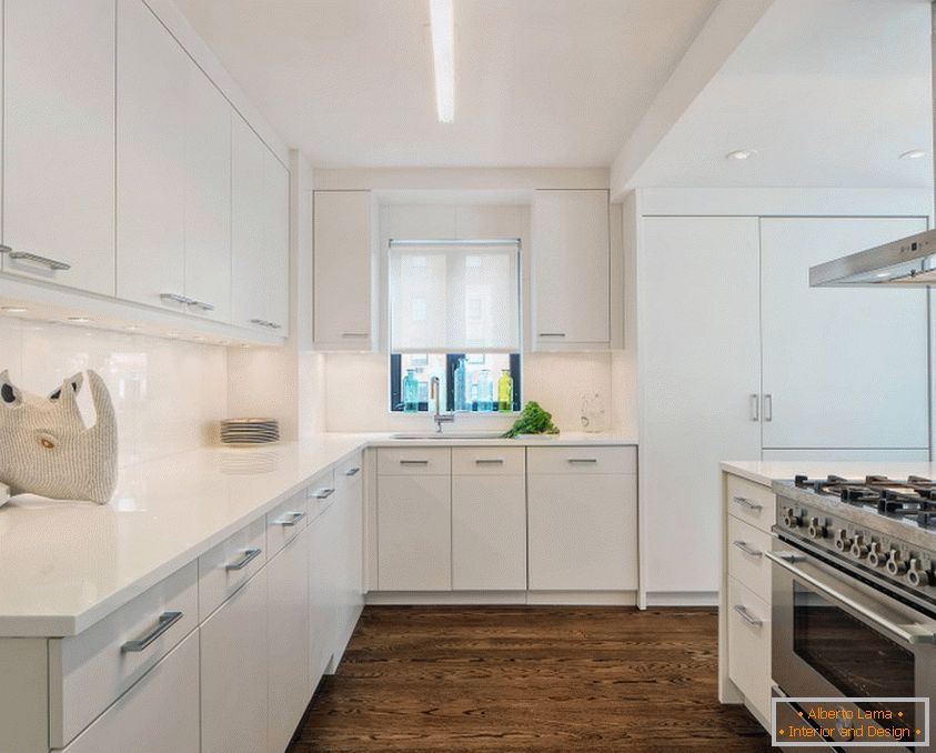 Modern kitchen in white tones with a dark floor and a perfectly white ceiling